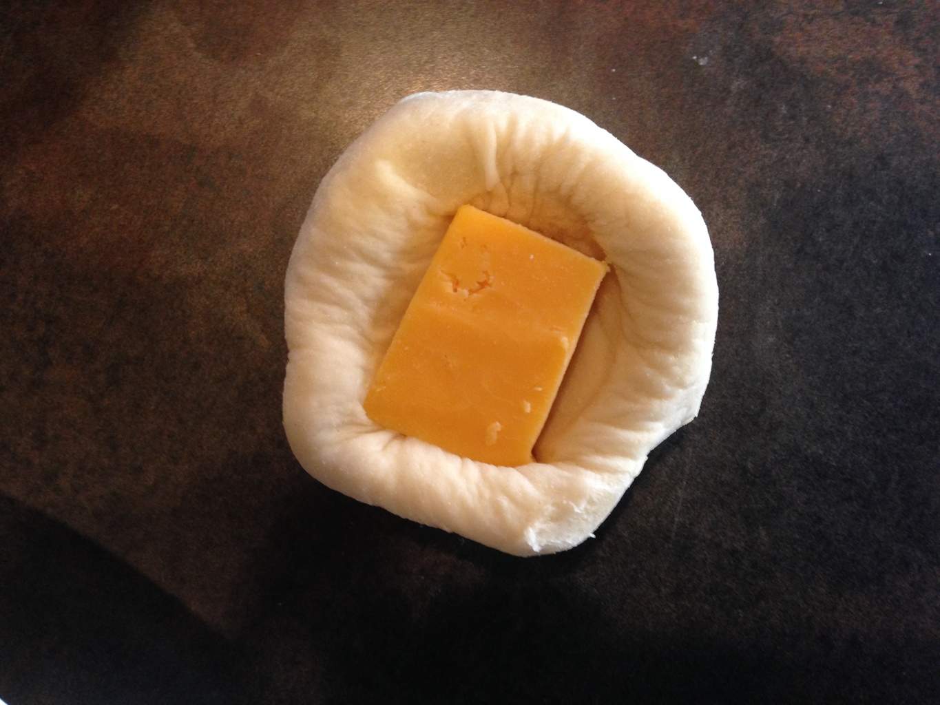 Rolling cheese in dough