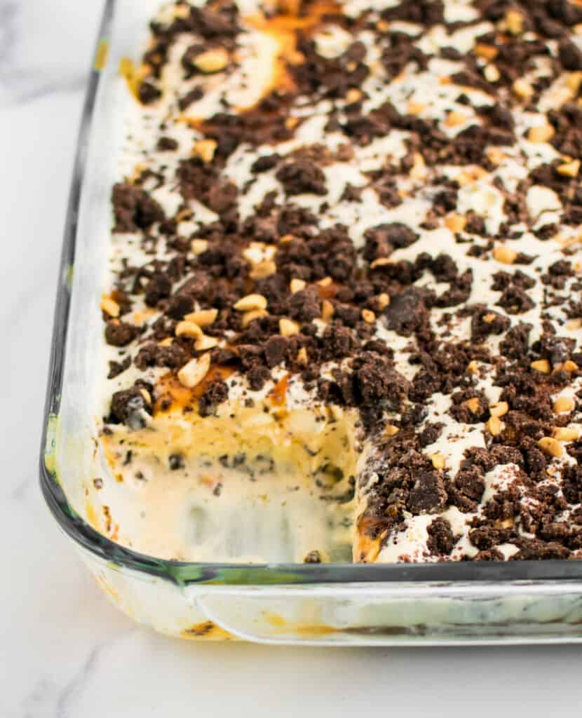 Closeup of Ice Cream Cake in Pan with One Slice Taken Out