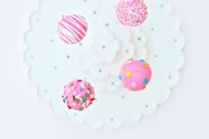 Cake pops decorated on a white stand