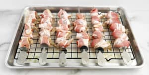Prepared Bacon Wrapped Shrimp Kabobs on Baking Rack