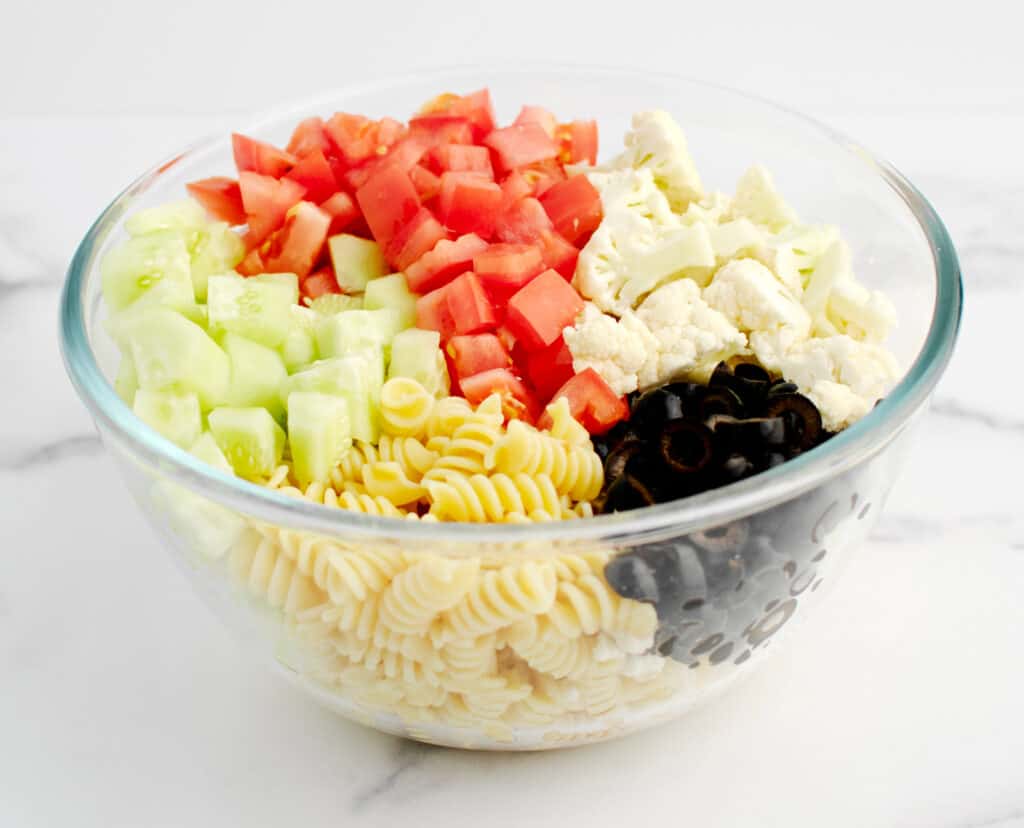 Pasta Salad Ingredients in Glass Bowl Before Mixing