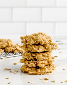 No Bake Peanut Butter Oatmeal Cookies Stacked with More Cookies on a Wire Rack