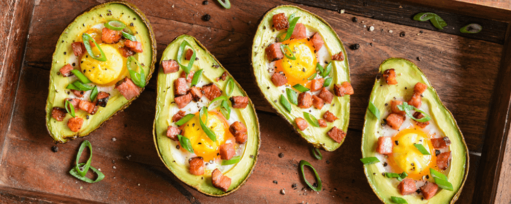 Avocado Baked Eggs Topped with Ham and Chives