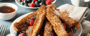French Toast Sticks with Berries and a Side of Syrup