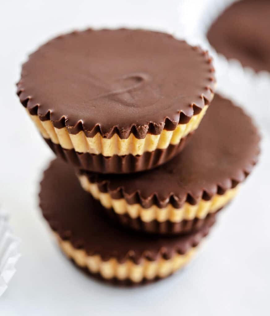 Three Peanut Butter Cups Stacked with Peanut Butter Layer in the Middle Visible