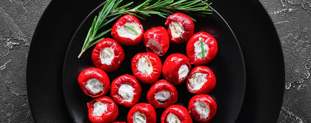 Stuffed Cherry Peppers on a Black Plate