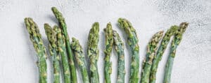 Frozen Asparagus Spears on a White Background
