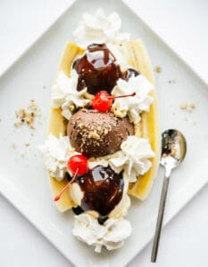 Banana Split on a Square White Plate with a Spoon