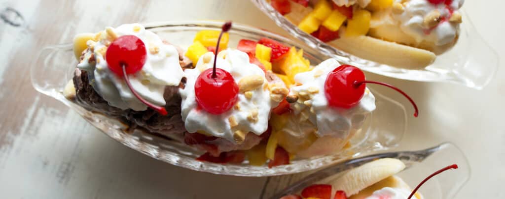 Banana Split in a Dish with Whipped Cream and Maraschino Cherries