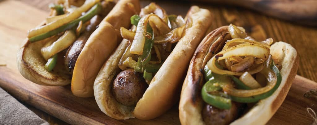 Grilled Bratwursts on Buns with Onions and Peppers