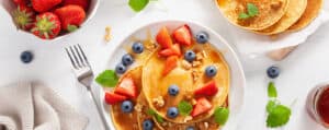 Pancakes Topped with Fresh Strawberries and Blueberries