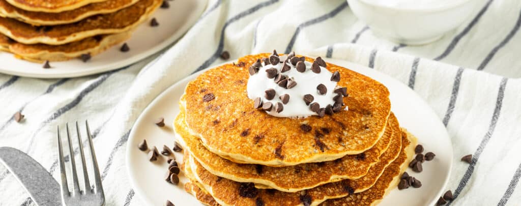 Pancakes Topped with Whipped Cream and Chocolate Chips
