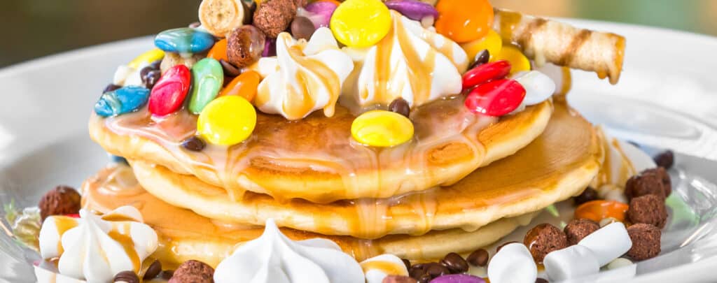 Pancakes Topped with Candy and Whipped Cream