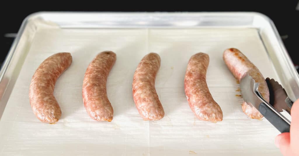 Brats on Baking Sheet with Parchment Paper