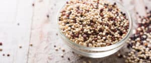 Quinoa in a Glass Bowl with Quinoa on the Counter
