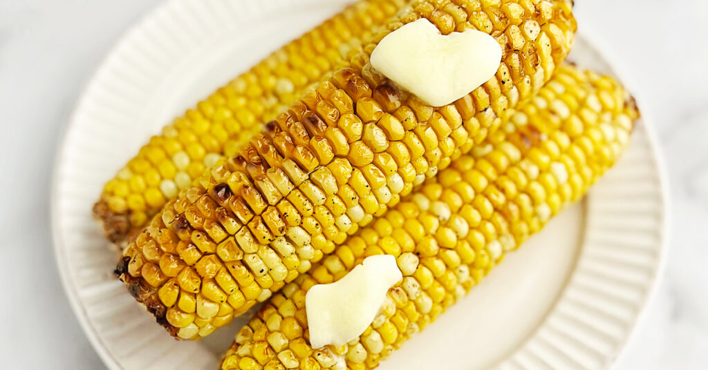 Air Fried Corn on the Cob with Butter on a Plate