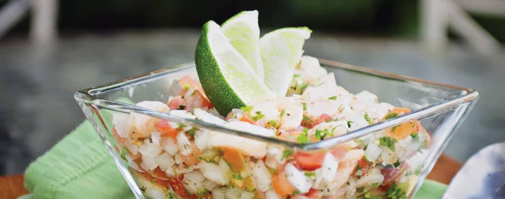 Ceviche Garnished with Lime Wedges