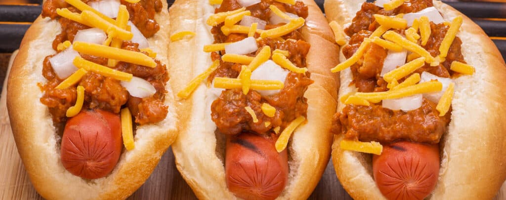 Three Chili Cheese Dogs on Hot Dog Buns