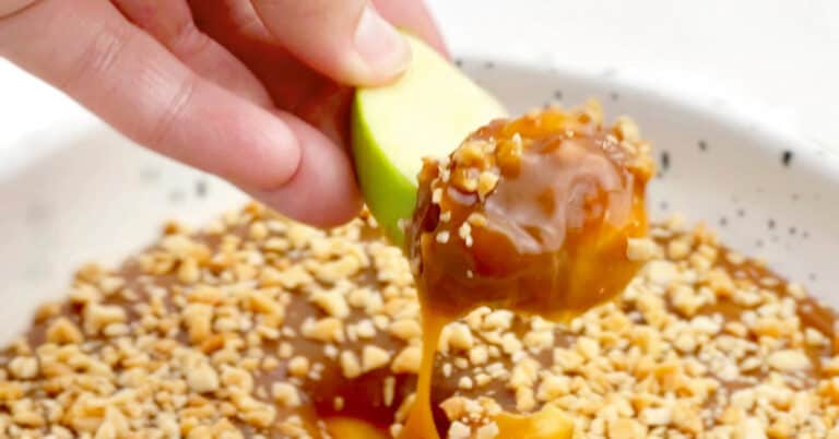 Caramel Apple Dip with Peanuts - Scooping with Green Apple