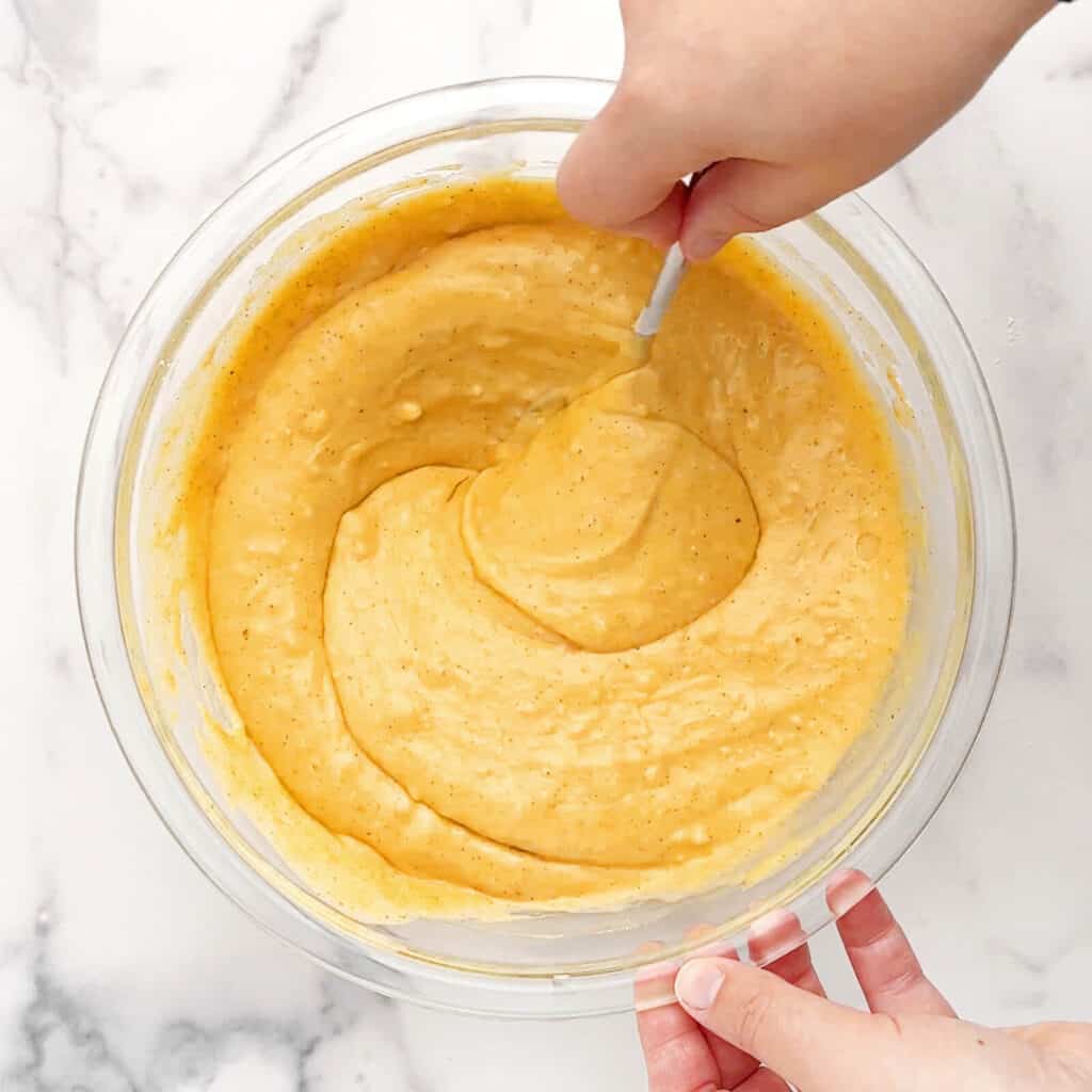 Pumpkin Waffle Batter Mixed in Bowl with Spoon