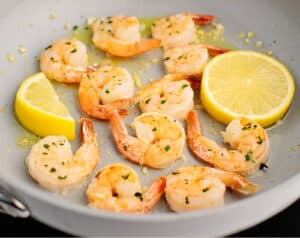 Fully Cooked Shrimp in Pan with Lemon Slices