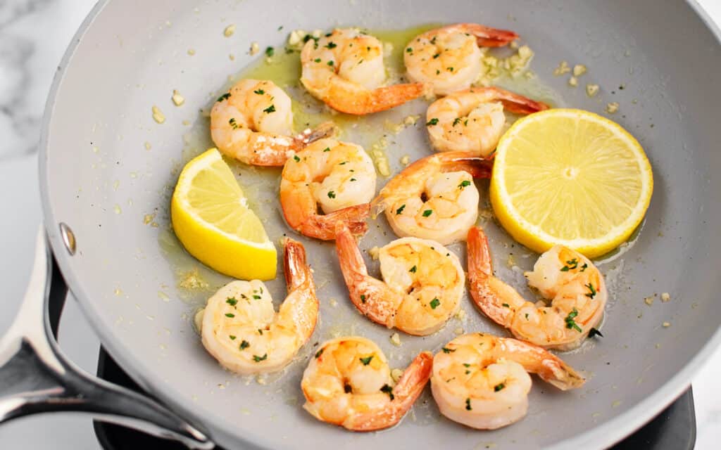 Fully Cooked Shrimp in Pan with Lemon Slices