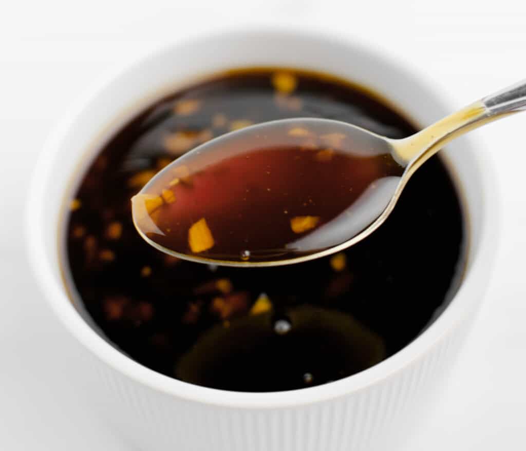 Homemade Teriyaki Sauce in White Bowl with Spoonful