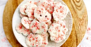 White Chocolate Peppermint Pretzel Crisps on Plate on Wooden Surface