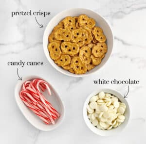 Pretzel Crisps, White Chocolate Chips, and Candy Canes on Marble Surface