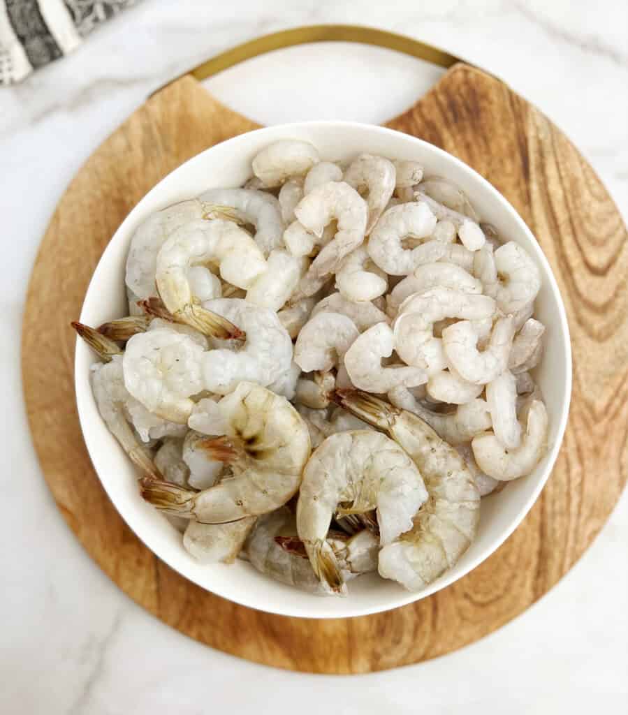 Shrimp in Different Sizes in Bowl on Wooden Surface