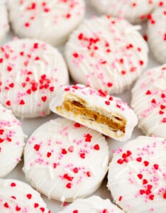 White Chocolate Cracker Valentine Cookies with One Cut Open Showing the Crackers and Peanut Butter Inside