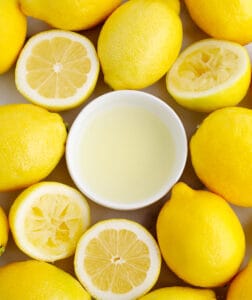 Bowl of Juice with Lemons Surrounding