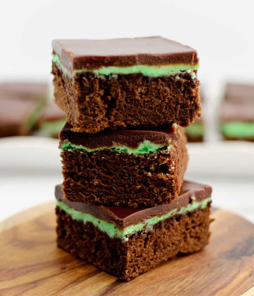 Stacked Mint Chocolate Brownies on Wooden Surface