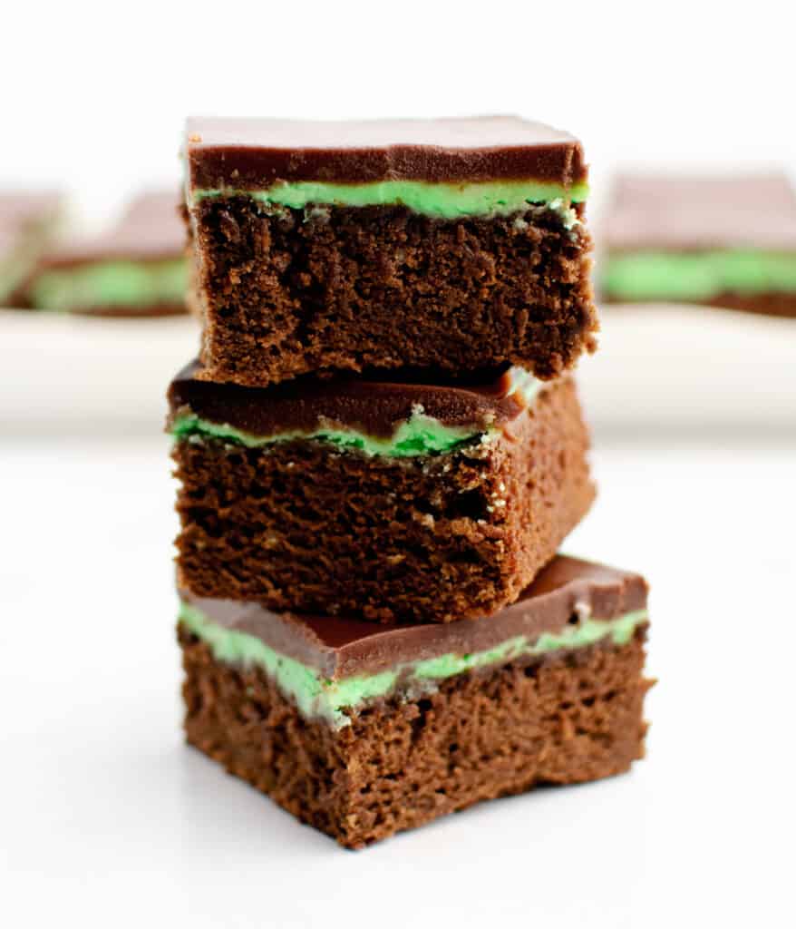 Mint Chocolate Brownies Stacked on White Marble Surface