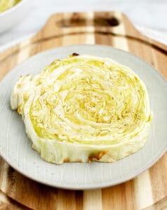 Cooked Cabbage Steak on Plate on Wooden Surface