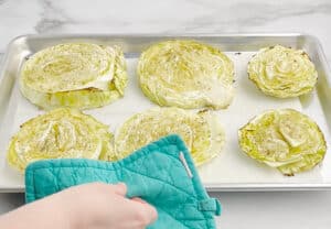 Taking Cooked Cabbage Steaks Out of the Oven