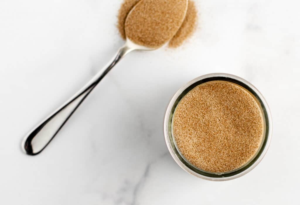 Sugar and Cinnamon Spice in Glass Jar with Spoon