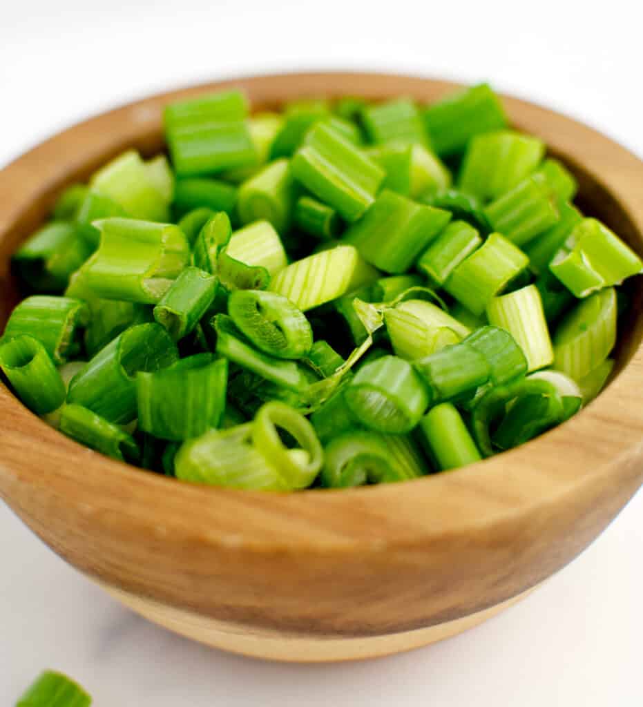 Chopped Green Onions in Wooden Bowl