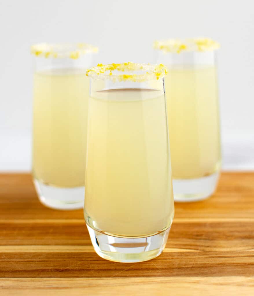 3 Shot Glasses Filled with Lemon Drop Cocktail