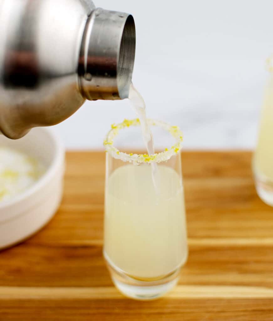 Pouring Lemon Drop Into Shot Glass