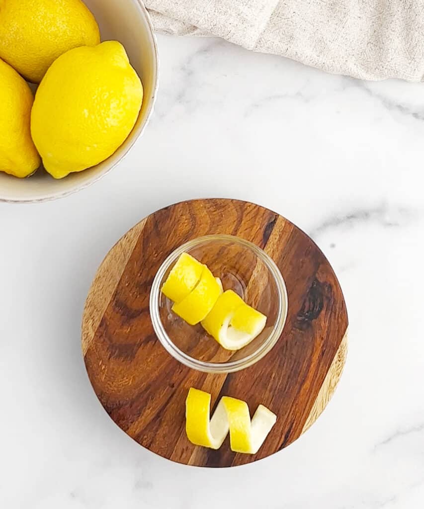 Lemon Twists on Wooden Coaster with Twist in Bowl