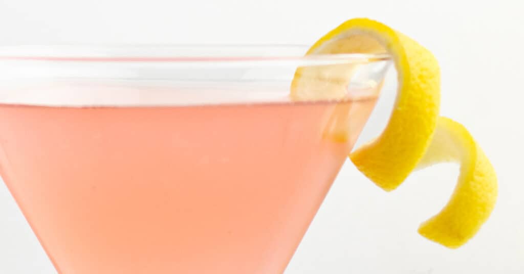 Lemon Twist on Rim of Pink Martini Cocktail Closeup