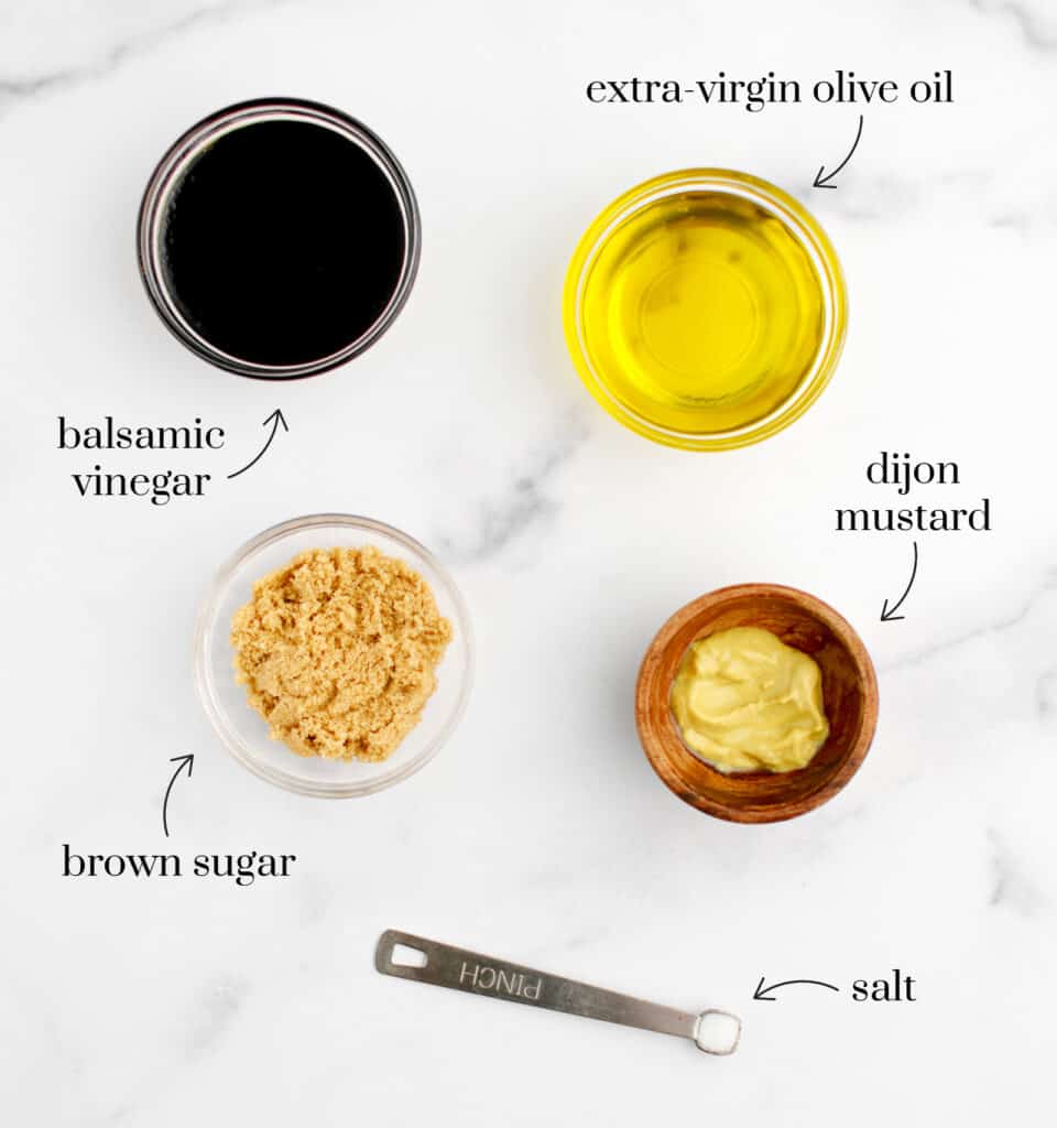Balsamic Vinegar, Olive Oil, Dijon Mustard, Brown Sugar, Salt on Marble Surface