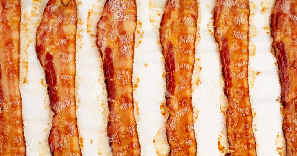 Oven Cooked Bacon in a Line on Parchment