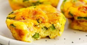 Egg Bites with Bites Taken Out on Speckled Plate