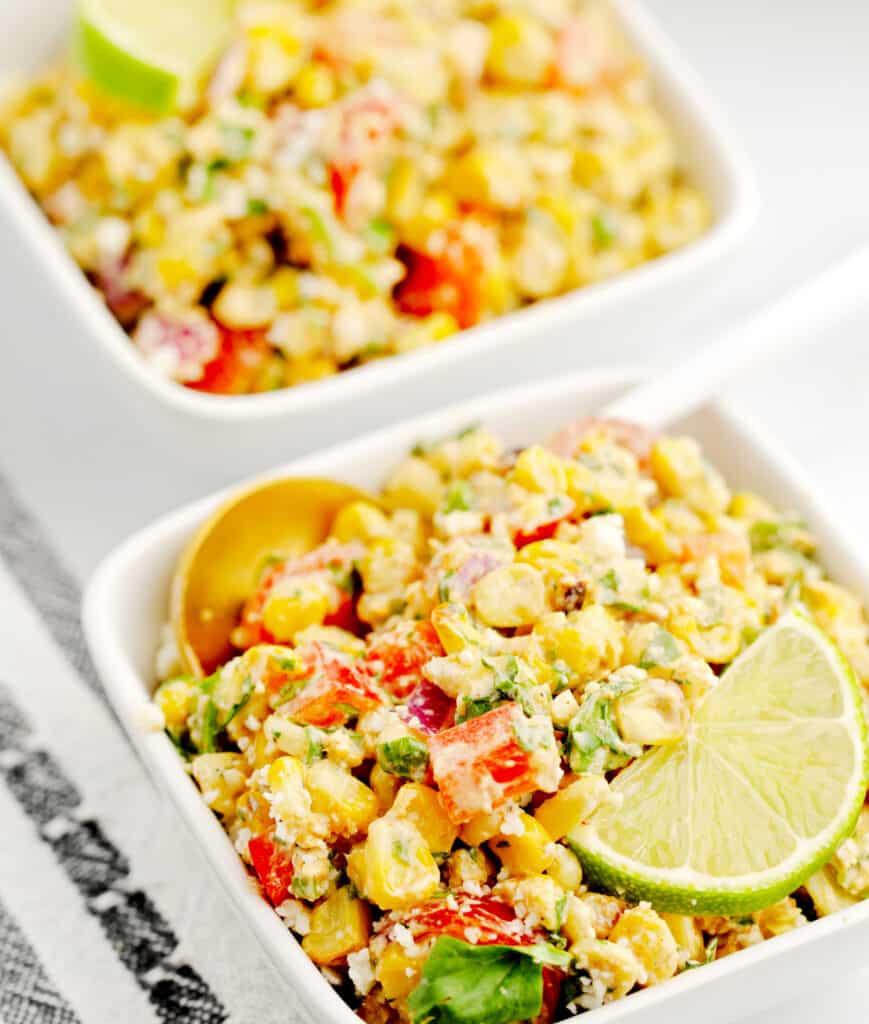 Corn Salad in White Square Bowls with Spoon