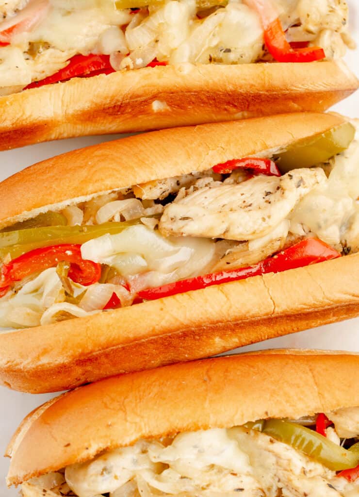 Three Chicken Cheesesteak Hoagies in a Row