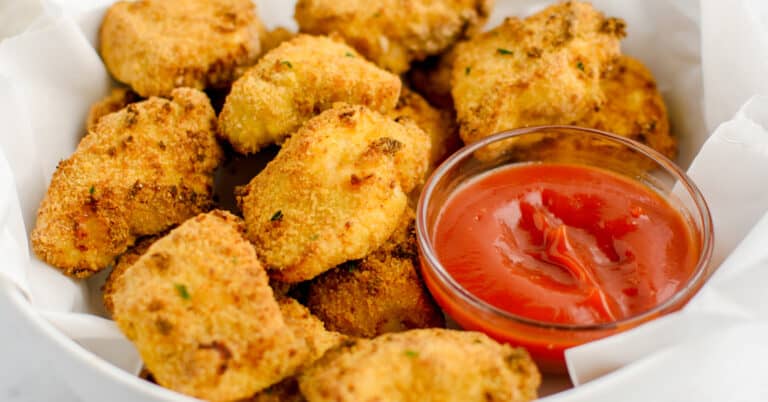 Closeup Air Fried Chicken Nuggets in White Dish with Ketchup