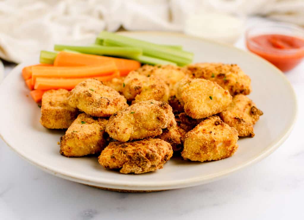 Plate of Nuggets and Veggies with Ketchup in Cup