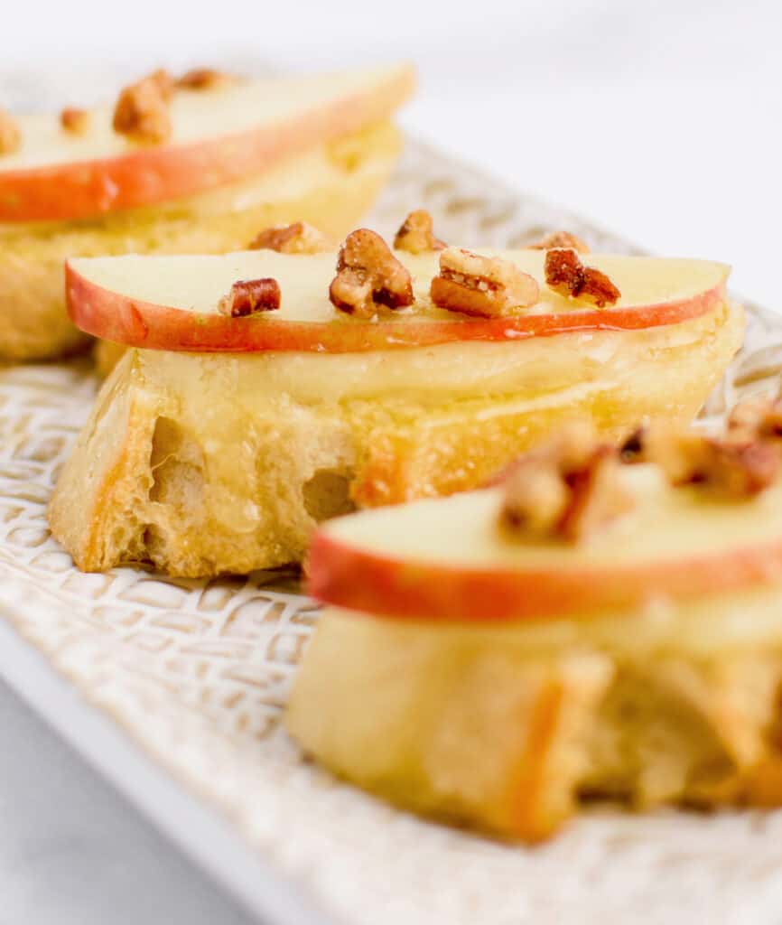 Brie, Apple, Honey Crostini Snacks on Serving Platter